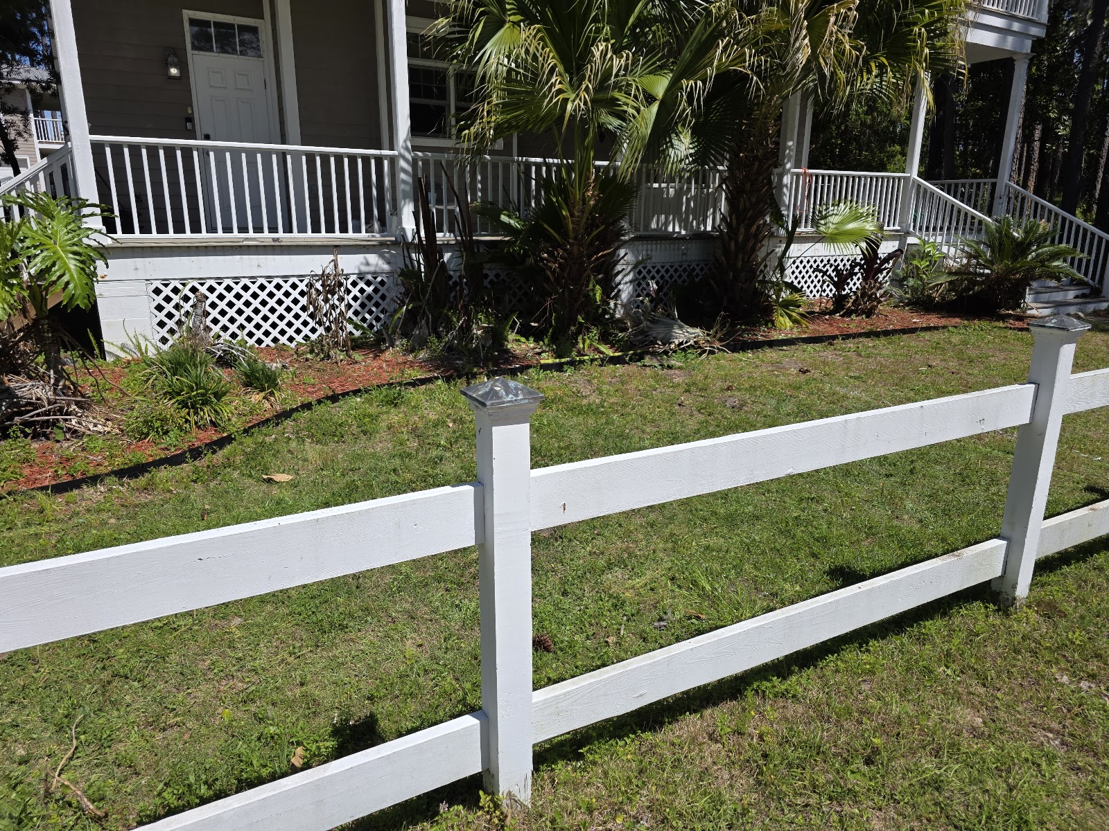 House with white fence rail and porch